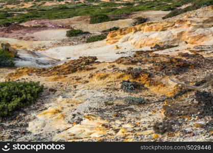 small rock formation in brown tones