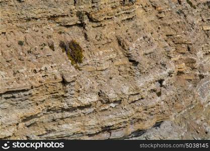 small rock formation in brown tones background