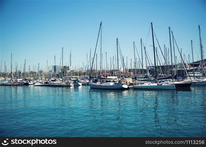 Small sailboats in a Barcelona harbor