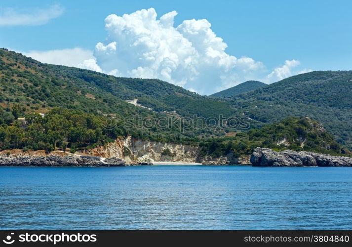 Small sandy beach and summer coast view from train ferry (Kefalonia, Greece)