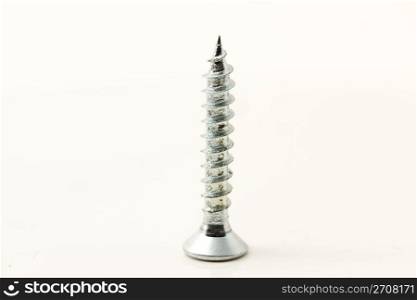 small screw. one small screw isolated on white background