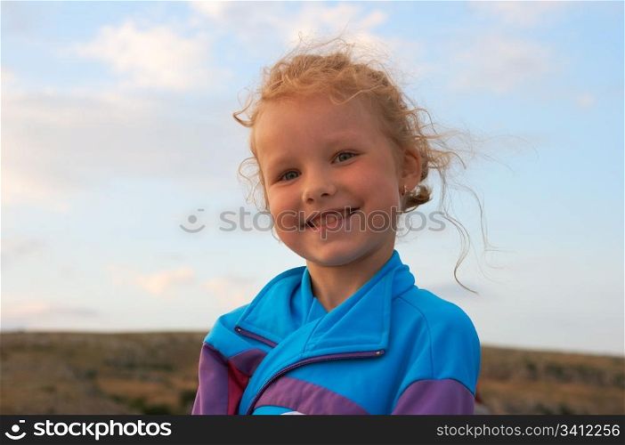 Small smiling girl outdoor portrait