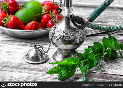 Small smoking hookah with strawberry,mint and lime