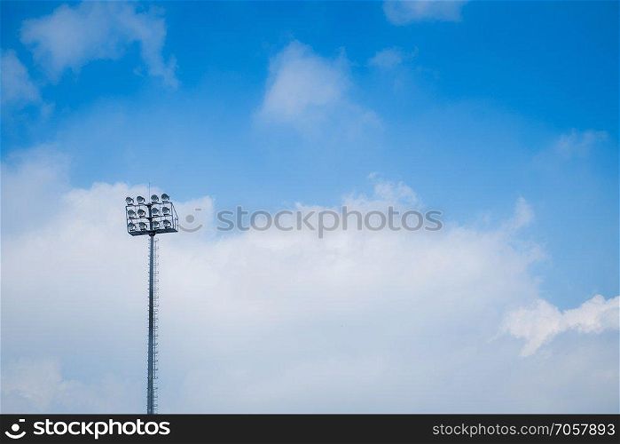 Small sports light with blue sky.