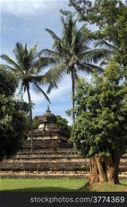 Small stone hindu temple under trees in Kandy, Sri Lanka