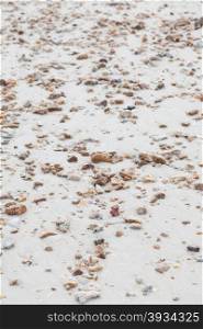 Small stones on the sand. full spread on the beach