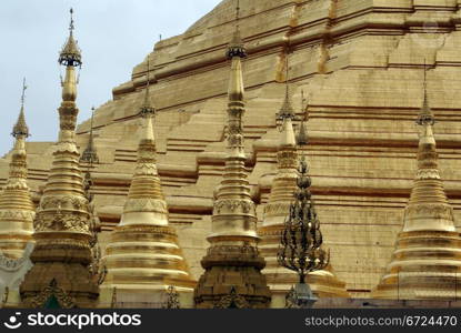 Small stupas and big Shwedagon Paya pagoda in Yangon, Myanmar