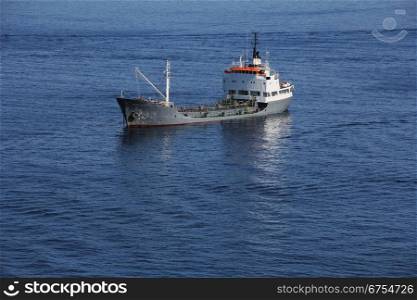 Small tanker ship at anchor