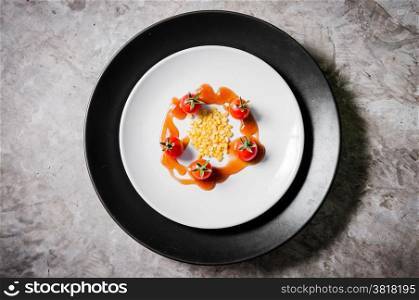small tomato and beans on white dish of bio food stylish