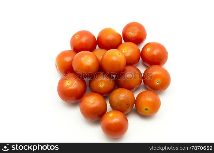 small tomatoes on a white background