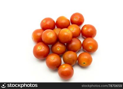 small tomatoes on a white background