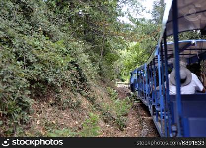 Small tourist train between Sainte Cecile d&rsquo;Andorge and Saint Julien des Ponts in the French department of Gard offers travelers a walk through woods.