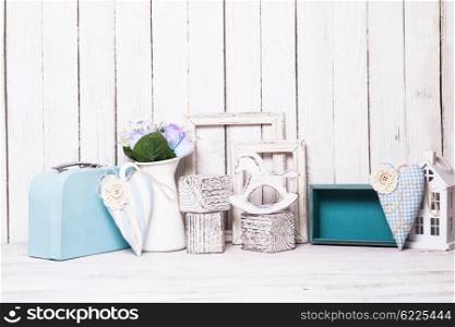 Small toy house, pony, bricks in the children&amp;#39;s room on wooden background