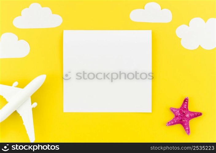 small toy plane with clouds blank paper