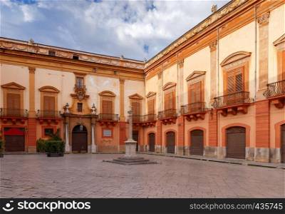 Small traditional town square in the early morning. Palermo. Sicily. Italy.. Palermo. Town Square at dawn.