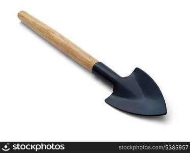 Small trowel for pot plants with wooden handle isolated on white