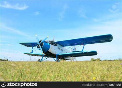 small utilitarian airplane detail at aerodrome with blue sky