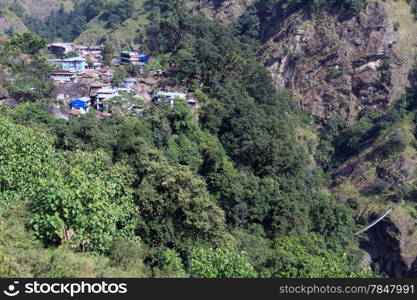 Small village and bridge in mountain, Nepal