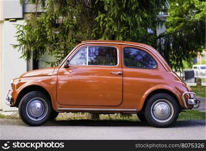 Small vintage italian car Fiat Abarth. Red color