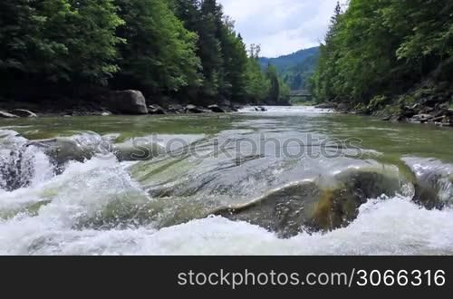 small waterfall and river in mountains Carpathians