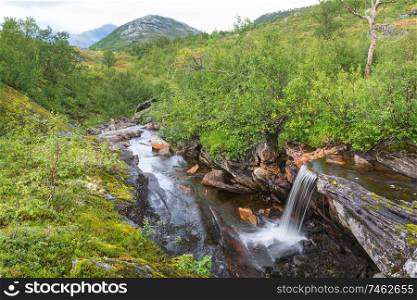 Small waterfall in Norway at summer season