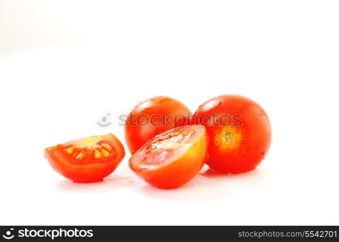 small wet fresh red tomato group isolated on white