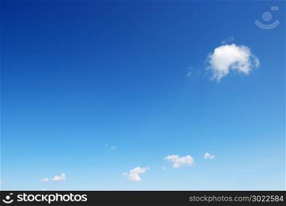 Small white cloud on background bright blue sky. Copy space