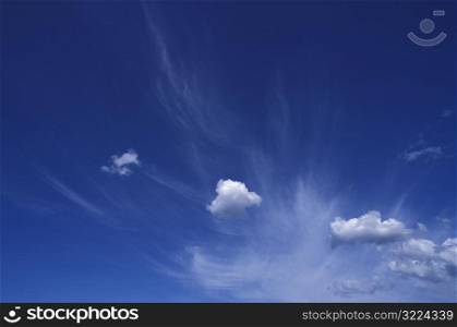 Small White Clouds In A Blue Sky