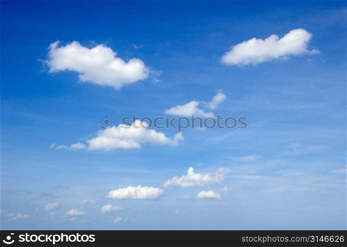 Small White Clouds In A Clear Blue Sky
