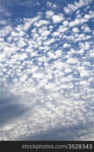 Small white clouds on blue sky