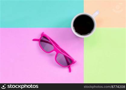Small white coffee cup and pink sunglasses on texture background of fashion pastel pink, blue, coral and lime colors paper in minimal concept.. Small white coffee cup and pink sunglasses on background of fashion pastel pink, blue, coral and lime colors