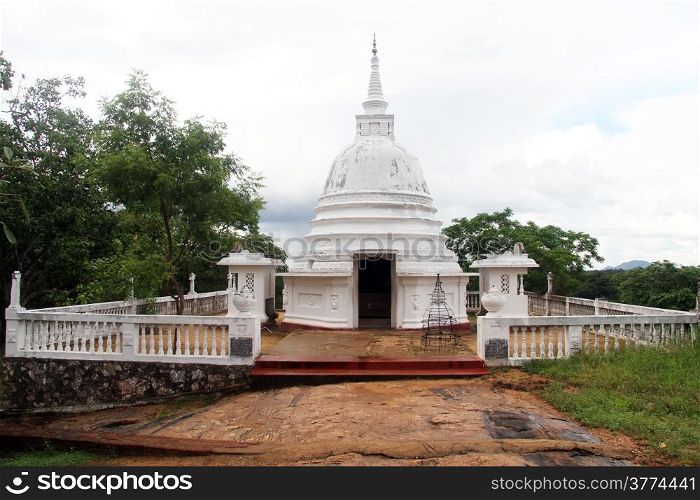 Small white stupa near Aukana buddha in Sri Lanka
