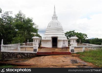 Small white stupa near Aukana buddha in Sri Lanka