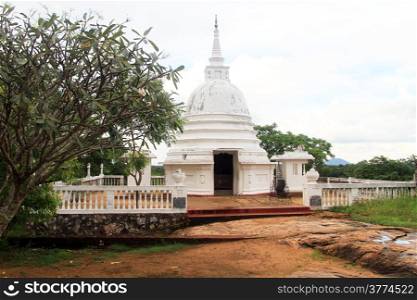 Small white stupa near Aukana Buddha in Sri Lanka