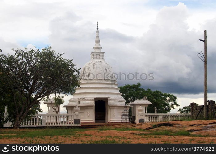 Small white stupa near Aukana Buddha in Sri Lsnka