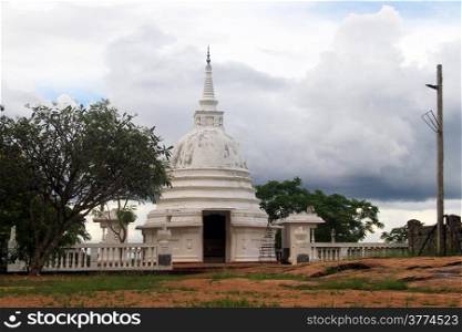 Small white stupa near Aukana Buddha in Sri Lsnka