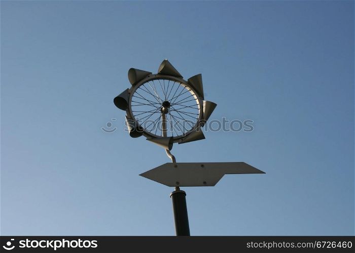 Small windmill with blue sky in the background