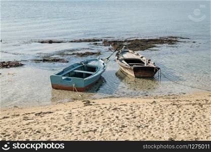 Small wooden boat on the beach called Chalana a typical small vessel from Rias Baixas, Galicia, Spain
