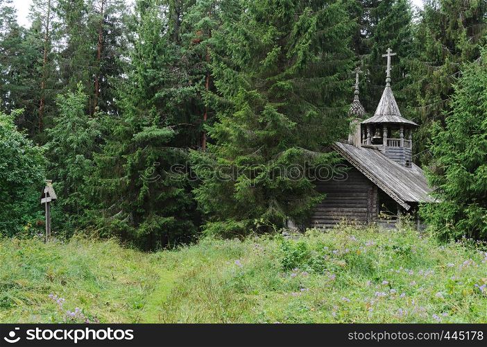 Small wooden chapel in forest on the Maura mountain, near Goritsa village, Vologda region, Russia