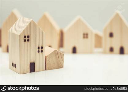 small wooden home model represent good community living together social concept.