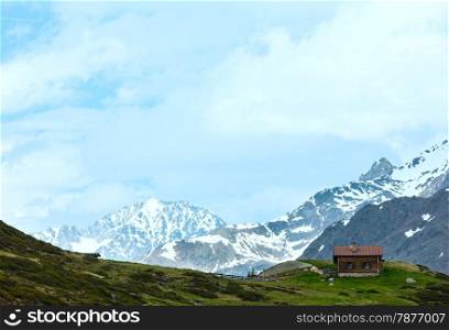 Small wooden house in summer Alps mountain (Austria).