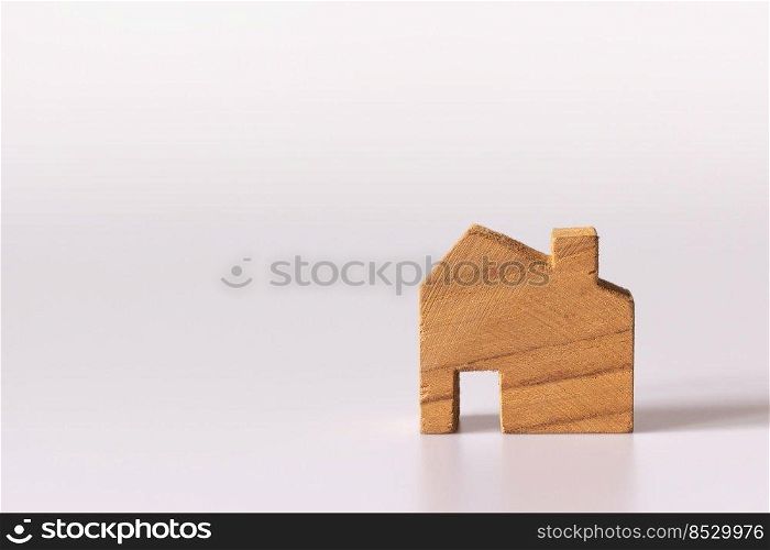 Small wooden house on white background and copy space