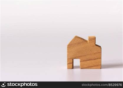 Small wooden house on white background and copy space