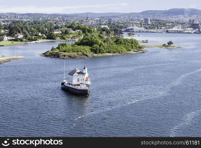 smalli sland with church in the harbor of Oslo norway