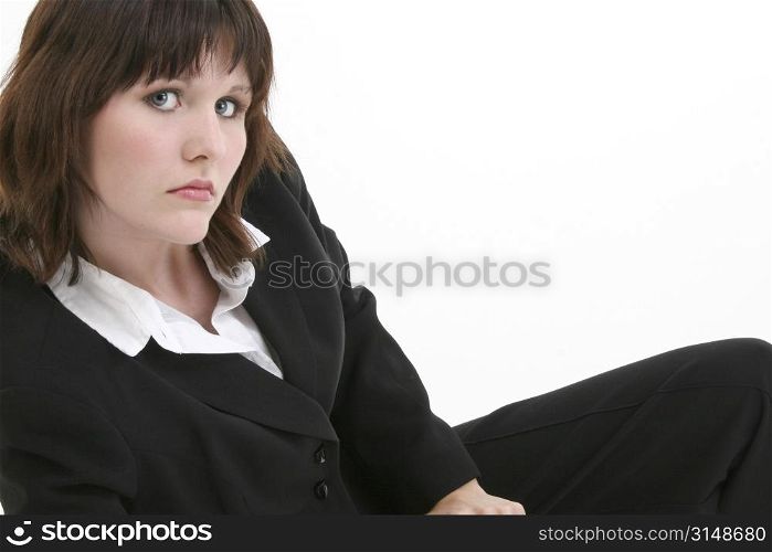 Smart and Beautiful young business woman. Brown hair, blue eyes, black business suit.