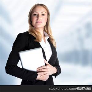 Smart business woman holding in hands laptop and standing in the office, work in great finance company, executive manager, good job concept