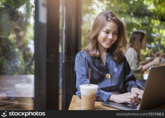 Smart business woman is working with computer