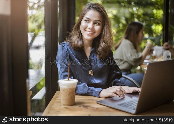 Smart business woman is working with computer