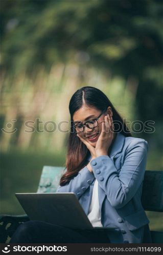 smart business woman working with laptop in the garden