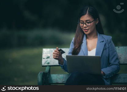 smart business woman working with laptop in the garden